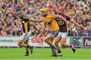 12 July 2014; Peter Duggan, Clare, in action against Keith Rossiter, left, and Lee Chin, Wexford. GAA Hurling All-Ireland Senior Championship Round 1 Replay, Clare v Wexford, Wexford Park, Wexford. Picture credit: Dáire Brennan / SPORTSFILE