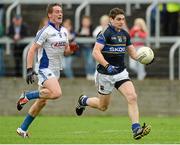 12 July 2014; Philip Austin, Tipperary, in action against Darren Strong, Laois. GAA Football All-Ireland Senior Championship Round 3A, Laois v Tipperary. O'Moore Park, Portlaoise, Co. Laois. Picture credit: Piaras Ó Mídheach / SPORTSFILE