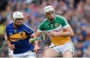 12 July 2014; Kevin Brady, Offaly, in action against Patrick Maher, Tipperary. GAA Hurling All-Ireland Senior Championship Round 2, Tipperary v Offaly. O'Moore Park, Portlaoise, Co. Laois. Picture credit: Piaras Ó Mídheach / SPORTSFILE