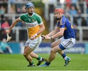 12 July 2014; Cathal Parlon, Offaly, in action against Denis Maher, Tipperary. GAA Hurling All-Ireland Senior Championship Round 2, Tipperary v Offaly. O'Moore Park, Portlaoise, Co. Laois. Picture credit: Piaras Ó Mídheach / SPORTSFILE