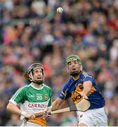 12 July 2014; Kevin Connolly, Offaly, in action against James Woodlock, Tipperary. GAA Hurling All-Ireland Senior Championship Round 2, Tipperary v Offaly. O'Moore Park, Portlaoise, Co. Laois. Picture credit: Piaras Ó Mídheach / SPORTSFILE
