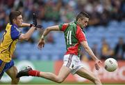 13 July 2014; Cian Hanley, Mayo, breaks through a challenge from Brian Stack, Roscommon, to score his side's first goal. Electric Ireland Connacht GAA Football Minor Championship Final, Mayo v Roscommon, Elverys MacHale Park, Castlebar, Co. Mayo. Picture credit: David Maher / SPORTSFILE