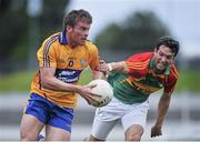 13 July 2014; Seán Collins, Clare, in action against Benny Kavanagh, Carlow. GAA Football All-Ireland Senior Championship Round 2B, Carlow v Clare, Dr Cullen Park, Carlow. Picture credit: Dáire Brennan / SPORTSFILE