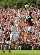 13 July 2014; Barry Moran, Mayo, palms the ball over Galway goalkeeper Manus Breathnach to score his side's third goal. Connacht GAA Football Senior Championship Final, Mayo v Galway, Elverys MacHale Park, Castlebar, Co. Mayo. Picture credit: Tomás Greally / SPORTSFILE