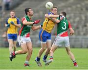13 July 2014; Luke Carty, Roscommon, in action against TJ Byrne and Barry Duffy, Mayo. Electric Ireland Connacht GAA Football Minor Championship Final, Mayo v Roscommon, Elverys MacHale Park, Castlebar, Co. Mayo. Picture credit: Ray Ryan / SPORTSFILE