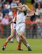 13 July 2014; Colm Cavanagh, Tyrone, is tackled by Tony Kernan, Armagh. GAA Football All-Ireland Senior Championship Round 2B, Tyrone v Armagh, Healy Park, Omagh, Co. Tyrone. Picture credit: Ramsey Cardy / SPORTSFILE