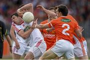 13 July 2014; Sean Cavanagh, Tyrone, in action against James Morgan, left, and Charlie Vernon, Armagh. GAA Football All-Ireland Senior Championship Round 2B, Tyrone v Armagh, Healy Park, Omagh, Co. Tyrone. Picture credit: Ramsey Cardy / SPORTSFILE