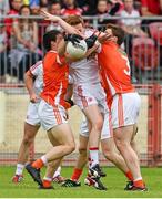 13 July 2014; Niall McKenna, Tyrone, in action against James Morgan, left, and Charlie Vernon, Armagh. GAA Football All-Ireland Senior Championship Round 2B, Tyrone v Armagh, Healy Park, Omagh, Co. Tyrone. Picture credit: Ramsey Cardy / SPORTSFILE