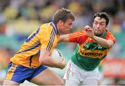 13 July 2014; Seán Collins, Clare, in action against Benny Kavanagh, Carlow. GAA Football All-Ireland Senior Championship Round 2B, Carlow v Clare, Dr Cullen Park, Carlow. Picture credit: Dáire Brennan / SPORTSFILE