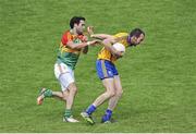 13 July 2014; Rory Donnelly, Clare, in action against Benny Kavanagh, Carlow. GAA Football All-Ireland Senior Championship Round 2B, Carlow v Clare, Dr Cullen Park, Carlow. Picture credit: Dáire Brennan / SPORTSFILE