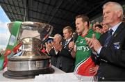13 July 2014; Andy Moran, Mayo captain with the Nestor cup with Taoiseach Enda Kenny  as he speaks to the supporters. Connacht GAA Football Senior Championship Final, Mayo v Galway, Elverys MacHale Park, Castlebar, Co. Mayo. Picture credit: Ray Ryan / SPORTSFILE