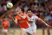 13 July 2014; Peter Hughes, Armagh, in action against Brendan Donaghy, Tyrone. GAA Football All-Ireland Senior Championship Round 2B, Tyrone v Armagh, Healy Park, Omagh, Co. Tyrone. Picture credit: Barry Cregg / SPORTSFILE