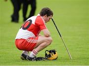 13 July 2014; A dejected John McCloskey, Derry, after the final whistle. Ulster GAA Hurling Senior Championship Final, Antrim v Derry, Owenbeg, Derry. Picture credit: Oliver McVeigh / SPORTSFILE