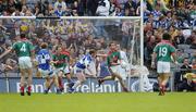 13 August 2006; Ronan McGarrity, Mayo, clears under pressure from Brian McDonald. Bank of Ireland All-Ireland Senior Football Championship Quarter-Final, Mayo v Laois, Croke Park, Dublin. Picture credit; Ray McManus / SPORTSFILE