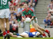 13 August 2006; Keith Higgins, Mayo, clears under pressure from Ross Munnelly, Laois. Bank of Ireland All-Ireland Senior Football Championship Quarter-Final, Mayo v Laois, Croke Park, Dublin. Picture credit; Ray McManus / SPORTSFILE