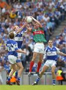 13 August 2006; Padraig Clancy, Laois, in action against Barry Moran, Mayo. Bank of Ireland All-Ireland Senior Football Championship Quarter-Final, Mayo v Laois, Croke Park, Dublin. Picture credit; Ray McManus / SPORTSFILE