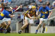 13 August 2006; John Mulhall, Kilkenny, in action against John O'Keeffe, left, and Eoin Hogan, Tipperary. All-Ireland Minor Hurling Championship, Semi-Final, Kilkenny v Tipperary, Croke Park, Dublin. Picture credit; Ray McManus / SPORTSFILE