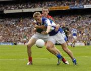13 August 2006; Ross Munnelly, Laois, in action against Keith Higgins, Mayo. Bank of Ireland All-Ireland Senior Football Championship Quarter-Final, Mayo v Laois, Croke Park, Dublin. Picture credit; Ray McManus / SPORTSFILE