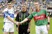 13 August 2006; Laois captain Fergal Byron and Mayo captain David Heaney, right, shake hands in front of referee Pat McEnaney. Bank of Ireland All-Ireland Senior Football Championship Quarter-Final, Mayo v Laois, Croke Park, Dublin. Picture credit; Ray McManus / SPORTSFILE