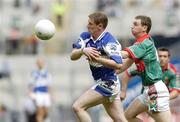 13 August 2006; Brian McDonald, Laois, in action against Keith Higgins, Mayo. Bank of Ireland All-Ireland Senior Football Championship Quarter-Final, Mayo v Laois, Croke Park, Dublin. Picture credit; Damien Eagers / SPORTSFILE