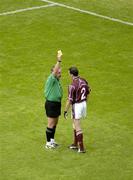 12 August 2006; Damien Healy, Westmeath, is shown the yellow card by referee Brian Crowe. Bank of Ireland All-Ireland Senior Football Championship, Quarter-Final, Dublin v Westmeath, Croke Park, Dublin. Picture credit; Ray McManus / SPORTSFILE