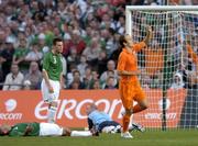16 August 2006; Arjen Robben, Netherlands, celebrates after scoring his side's second goal as dejected Republic of Ireland players, from left, Stephen Carr, Steve Finnan and goalkeeper Paddy Kenny look on. International Friendly, Republic of Ireland v Netherlands, Lansdowne Road, Dublin. Picture credit; David Maher / SPORTSFILE