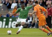 16 August 2006; Clinton Morrison, Republic of Ireland, has a shot at goal despite the presents of Andre Ooijer, Netherlands. International Friendly, Republic of Ireland v Netherlands, Lansdowne Road, Dublin. Picture credit; Matt Browne / SPORTSFILE