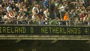 16 August 2006; Some patrons yawn and some leave as their score board reads 4 - 0, the final score. International Friendly, Republic of Ireland v Netherlands, Lansdowne Road, Dublin. Picture credit; Matt Browne / SPORTSFILE