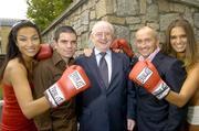 17 August 2006; RTE Commentator Jimmy Magee, centre, with former World featherweight champion Barry McGuigan, right, Irish boxer Bernard Dunne, models Roberta Rowat, extreme right, and Gail Kaneswaren at the announcement of details of former five time World champion &quot;Sugar&quot; Ray Leonard's upcoming visit to Ireland in October. The highlight of his trip will be a gala dinner held in his honour at the Burlington Hotel which will be compered by Jimmy Magee. Burlington Hotel, Dublin. Picture credit; Matt Browne / SPORTSFILE
