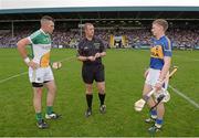 12 July 2014; Referee Alan Kelly with captains Joe Bergin, left, Offaly, and Brendan Maher, Tipperary, before the game. GAA Hurling All-Ireland Senior Championship Round 2, Tipperary v Offaly. O'Moore Park, Portlaoise, Co. Laois. Picture credit: Piaras Ó Mídheach / SPORTSFILE