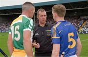 12 July 2014; Referee Alan Kelly with captains Joe Bergin, left, Offaly and Brendan Maher, Tipperary before the game. GAA Hurling All-Ireland Senior Championship Round 2, Tipperary v Offaly. O'Moore Park, Portlaoise, Co. Laois. Picture credit: Piaras Ó Mídheach / SPORTSFILE