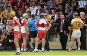 13 July 2014; Match referee Fergal Horgan, issues a red card to Tiaran McCluskey, Derry. Ulster GAA Hurling Senior Championship Final, Antrim v Derry, Owenbeg, Derry. Picture credit: Oliver McVeigh / SPORTSFILE