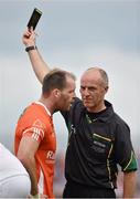 13 July 2014; Ciarán McKeever, Armagh, receives a black card from referee Cormac Reilly after his challenge on Patrick McEnice, Tyrone. GAA Football All-Ireland Senior Championship Round 2B, Tyrone v Armagh, Healy Park, Omagh, Co. Tyrone. Picture credit: Barry Cregg / SPORTSFILE