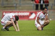 13 July 2014; A dejected Colm Kavanagh, left, and Kyle Coney, right, Tyrone after the game. GAA Football All-Ireland Senior Championship Round 2B, Tyrone v Armagh, Healy Park, Omagh, Co. Tyrone. Picture credit: Barry Cregg / SPORTSFILE