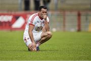 13 July 2014; A dejected Kyle Coney, Tyrone after the game. GAA Football All-Ireland Senior Championship Round 2B, Tyrone v Armagh, Healy Park, Omagh, Co. Tyrone. Picture credit: Barry Cregg / SPORTSFILE