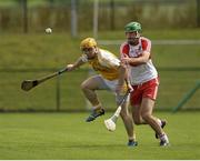 13 July 2014; Chris McGuinness, Antrim, in action against Ruairi Convery, Derry. Ulster GAA Hurling Senior Championship Final, Antrim v Derry, Owenbeg, Derry. Picture credit: Oliver McVeigh / SPORTSFILE