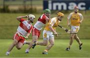 13 July 2014; Chris McGuinness, Antrim, in action against Anton Rafferty and Ruairi Convery, Derry. Ulster GAA Hurling Senior Championship Final, Antrim v Derry, Owenbeg, Derry. Picture credit: Oliver McVeigh / SPORTSFILE