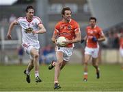13 July 2014; Kevin Dyas, Armagh, in action against Colm Cavanagh, Tyrone. GAA Football All-Ireland Senior Championship Round 2B, Tyrone v Armagh, Healy Park, Omagh, Co. Tyrone. Picture credit: Barry Cregg / SPORTSFILE