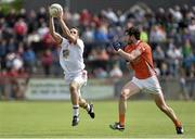 13 July 2014; Mark Donnelly, Tyrone, in action against Aaron Findon, Armagh. GAA Football All-Ireland Senior Championship Round 2B, Tyrone v Armagh, Healy Park, Omagh, Co. Tyrone. Picture credit: Barry Cregg / SPORTSFILE