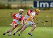 13 July 2014; Chris McGuinness, Antrim, in action against Anton Rafferty and Ruairi Convery, Derry. Ulster GAA Hurling Senior Championship Final, Antrim v Derry, Owenbeg, Derry. Picture credit: Oliver McVeigh / SPORTSFILE
