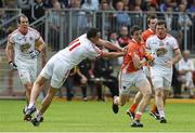 13 July 2014; Rory Grugan, Armagh, in action against Kyle Coney, Tyrone. GAA Football All-Ireland Senior Championship Round 2B, Tyrone v Armagh, Healy Park, Omagh, Co. Tyrone. Picture credit: Ramsey Cardy / SPORTSFILE