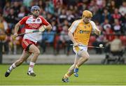 13 July 2014; Chris McGuinness, Antrim, in action against Liam Og Hinphey, Derry. Ulster GAA Hurling Senior Championship Final, Antrim v Derry, Owenbeg, Derry. Picture credit: Oliver McVeigh / SPORTSFILE