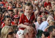 13 July 2014; A young Cork supporter during the cup presentation. Munster GAA Hurling Senior Championship Final, Cork v Limerick, Pairc Uí Chaoimh, Cork. Picture credit: Diarmuid Greene / SPORTSFILE