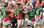 13 July 2014; Mayo players, from left, Sean Conlon, Brian Reape, Conor Burke and David Hanley celebrate after the match. Electric Ireland Connacht GAA Football Minor Championship Final, Mayo v Roscommon, Elverys MacHale Park, Castlebar, Co. Mayo. Picture credit: Ray Ryan / SPORTSFILE