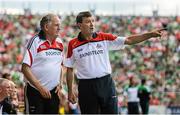 13 July 2014; Cork manager Jimmy Barry Murphy in conversation with Dr. Con Murphy during the second half. Munster GAA Hurling Senior Championship Final, Cork v Limerick, Pairc Uí Chaoimh, Cork. Picture credit: Diarmuid Greene / SPORTSFILE