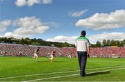 13 July 2014; Limerick manager TJ Ryan looks on as Aidan Walsh, Cork, gains possession ahead of Limerick's Kevin Downes. Munster GAA Hurling Senior Championship Final, Cork v Limerick, Pairc Uí Chaoimh, Cork. Picture credit: Diarmuid Greene / SPORTSFILE