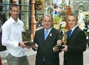 14 August 2006; GAA President Nickey Brennan with Waterford hurler Dan Shanahan and Laois footballer Ross Munnelly who were presented with the Vodafone Player of the Month awards for the month of July. Westbury Hotel, Dublin. Picture credit: Pat Murphy / SPORTSFILE