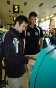 16 August 2006; Irish rowers Gearoid Towey, left, and Sean Jacob check in at Dublin Airport ahead of the Irish Rowing team's departure to the World Rowing Championships to be held from the 20th to the 27th August in London, England. Dublin Airport, Dublin. Picture credit: Brendan Moran / SPORTSFILE