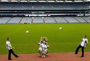 16 August 2006; Ruth O'Neill, centre, Rachel Cunningham, age 12, left, and her brother Patrick, aged 9, jump for possession from Offaly goalkeeper Padraic Kelly, left, and Dublin footballer Ciaran Whelan at the launch of the 7th annual MBNA Kick Fada competition, which will take place at Bray Emmets GAA Club, Bray, Co. Wicklow, on Saturday, September 9th. Croke Park, Dublin. Picture credit: Pat Murphy / SPORTSFILE