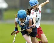 19 August 2006; Andrea Fitzpatrick, Dublin, in action against Jane Kelly, Derry. All-Ireland Junior Camogie Championship Final, Dublin v Derry, O'Connor Park, Tullamore, Co. Offaly. Picture credit; Matt Browne / SPORTSFILE